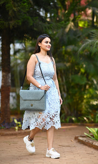 A woman is holding Zenkindstore's Laptop Bag